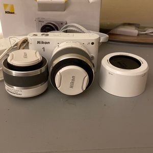 Nikon 1 camera in white, used only once and like brand new.